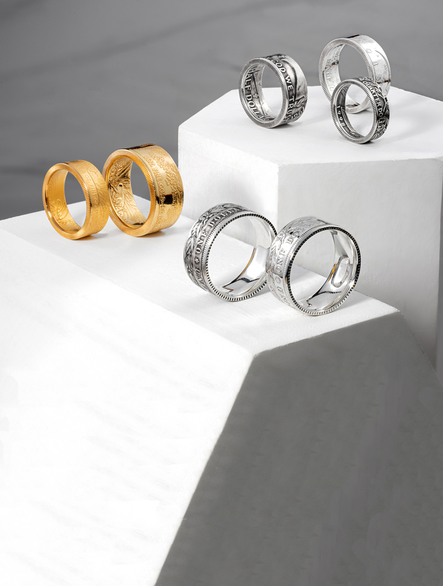 Display of Coin Jewelry including American Eagle Gold Coin Ring, Silver Dollar Coin Ring, Half Dollar Ring, Quarter Ring