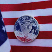 Silver Kennedy Half Dollar with American Flag Reflection